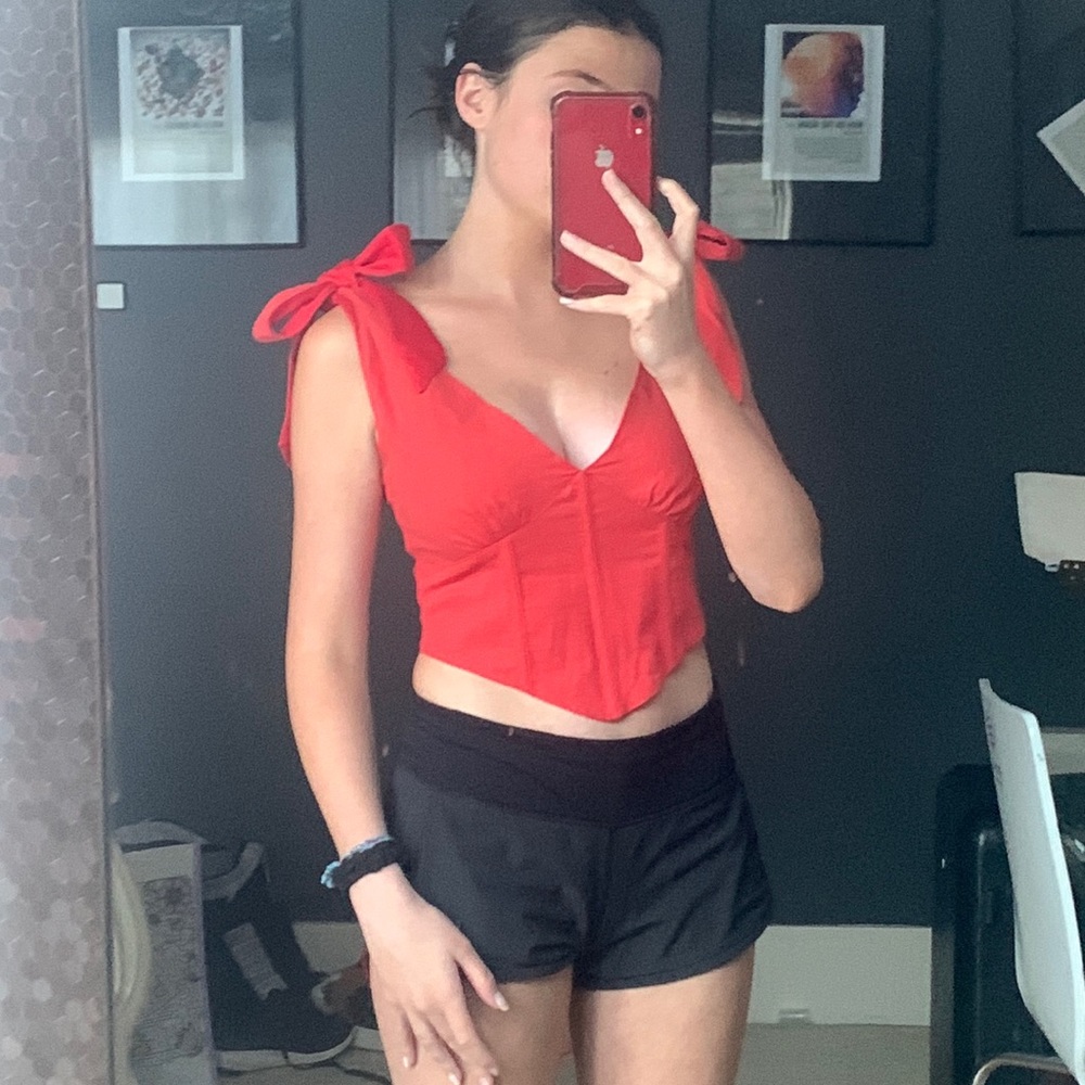 Red tank top with straps that tie in a bow